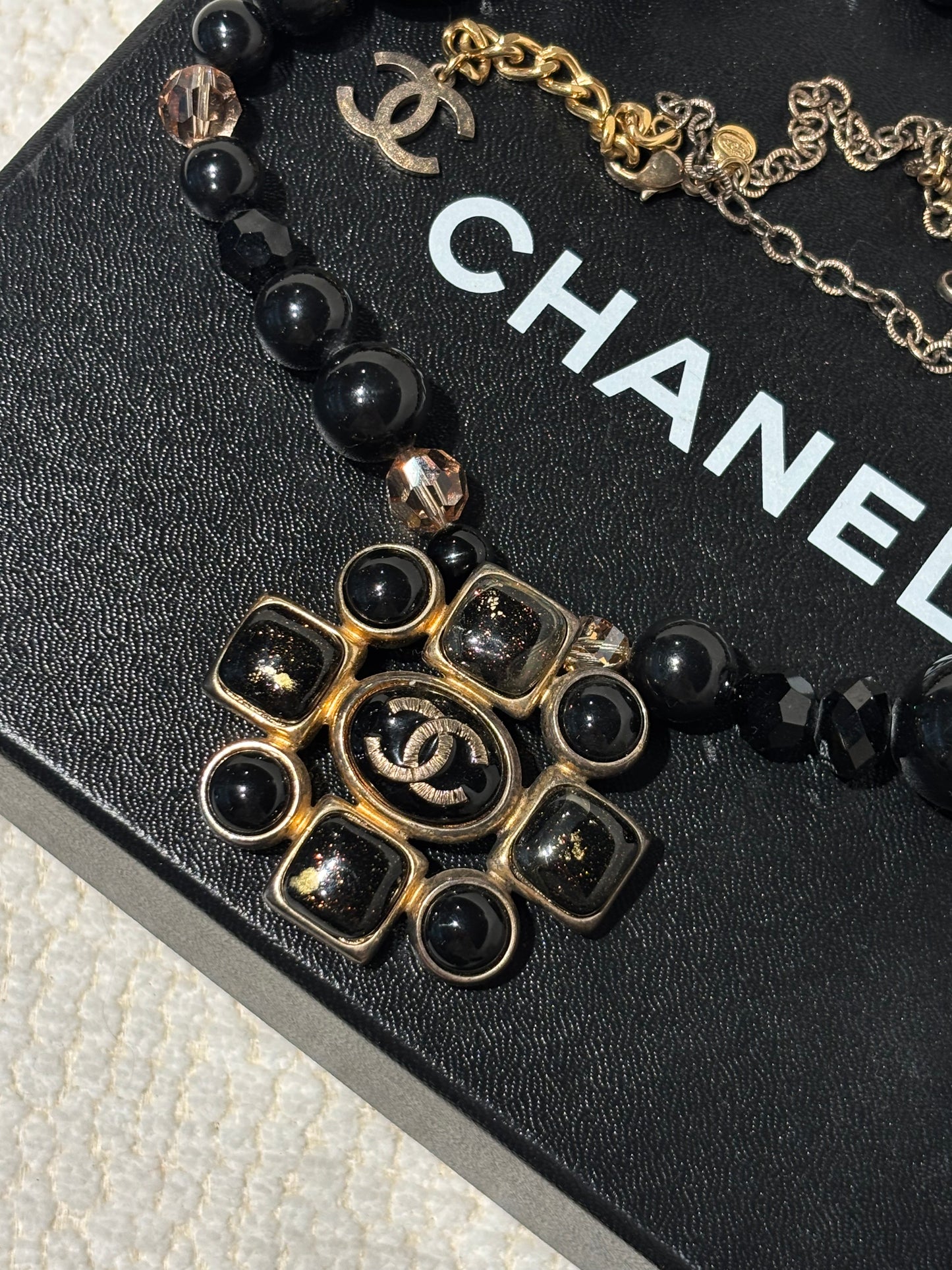 Chanel Camellia Statement Necklace – Black Beads with Gold-Tone CC Logo