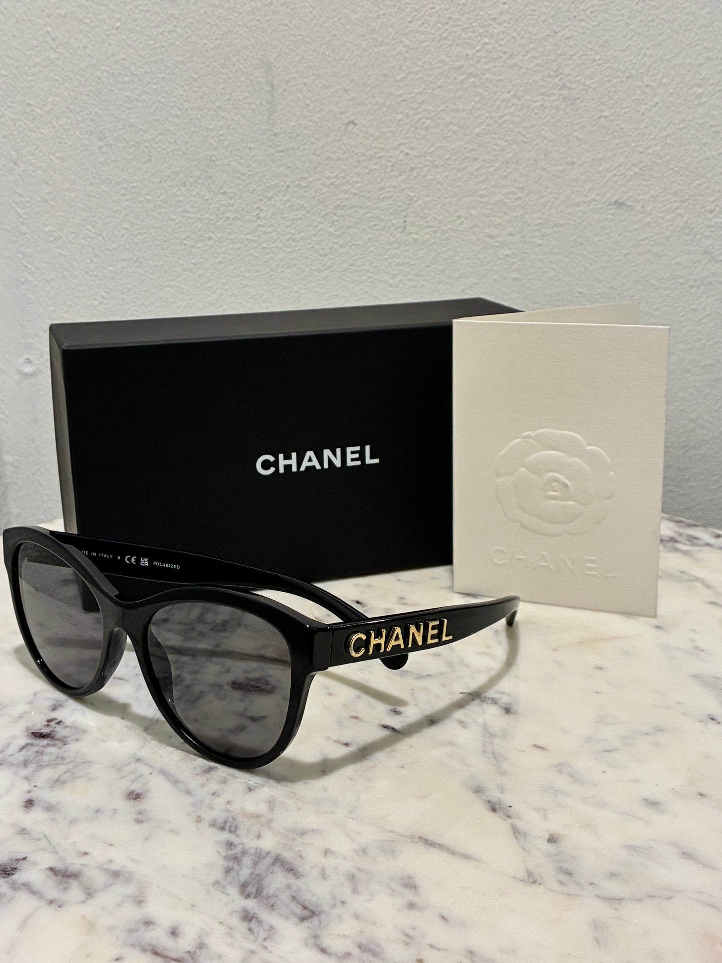 Chanel Sunglasses - Gold CHANEL Logo text