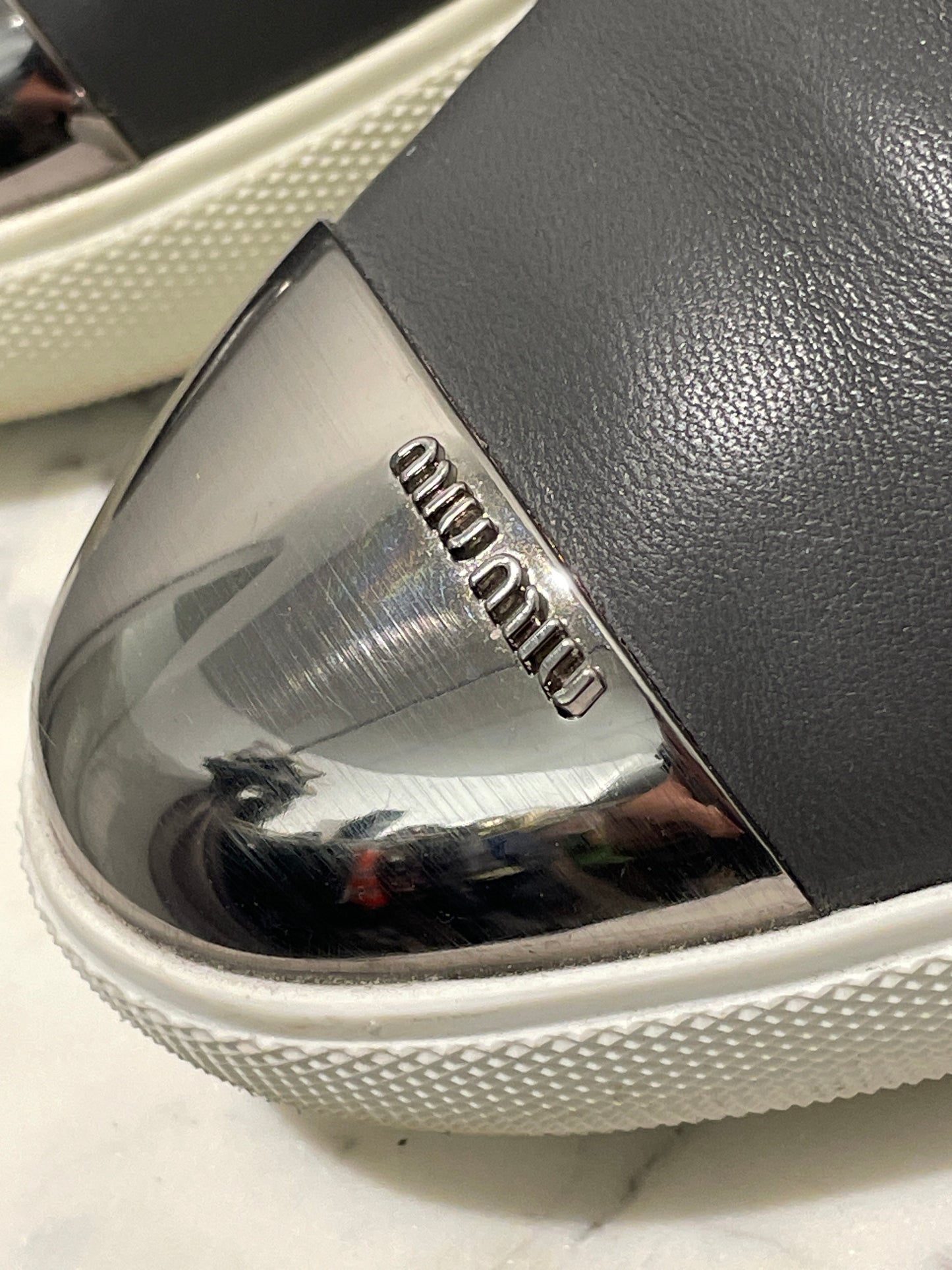 Authentic Miu Miu Grey Leather Metal Cap-Toe Slip-On Sneakers - 39