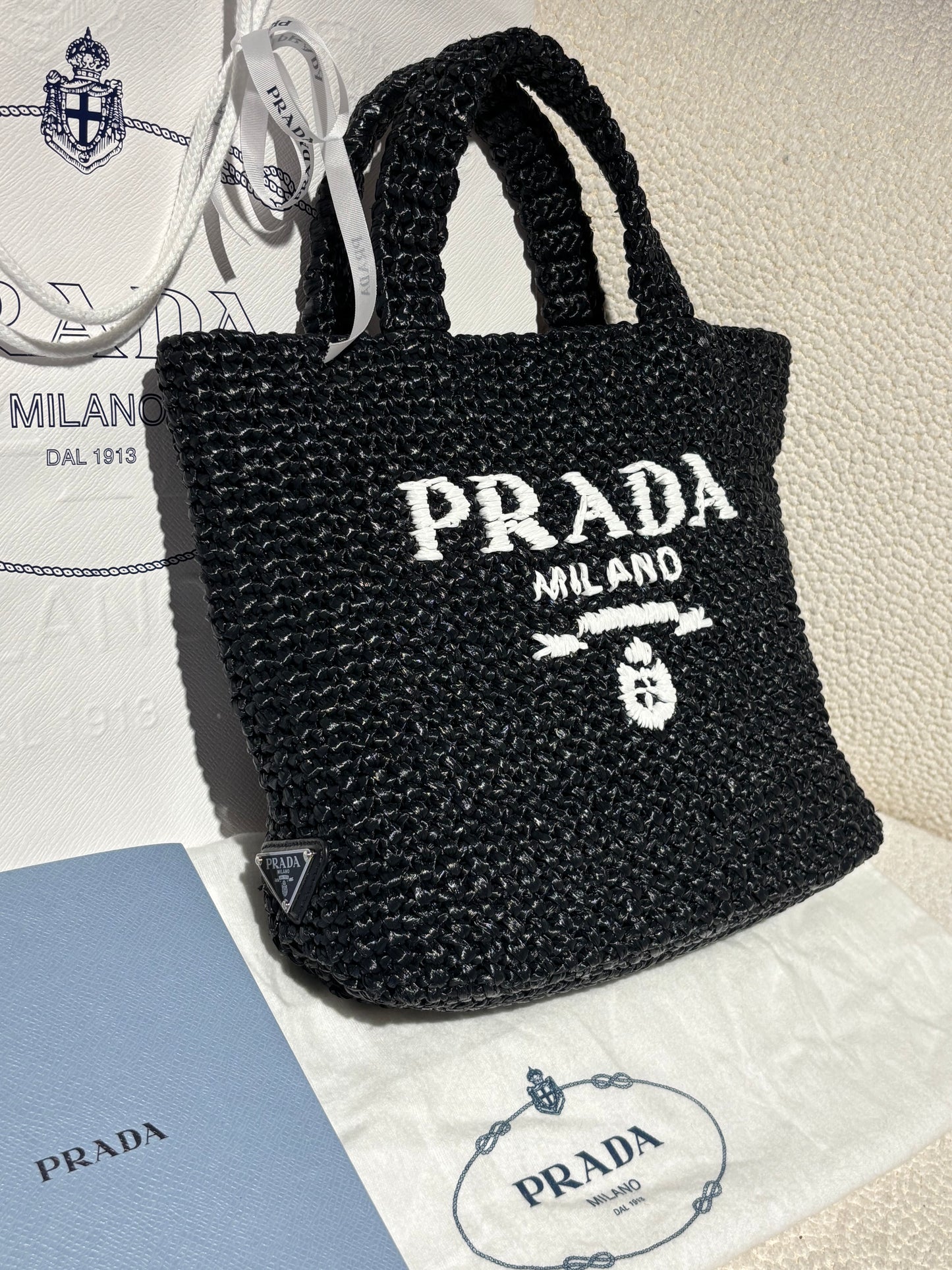Prada Raffia Tote – Black with White Logo Text