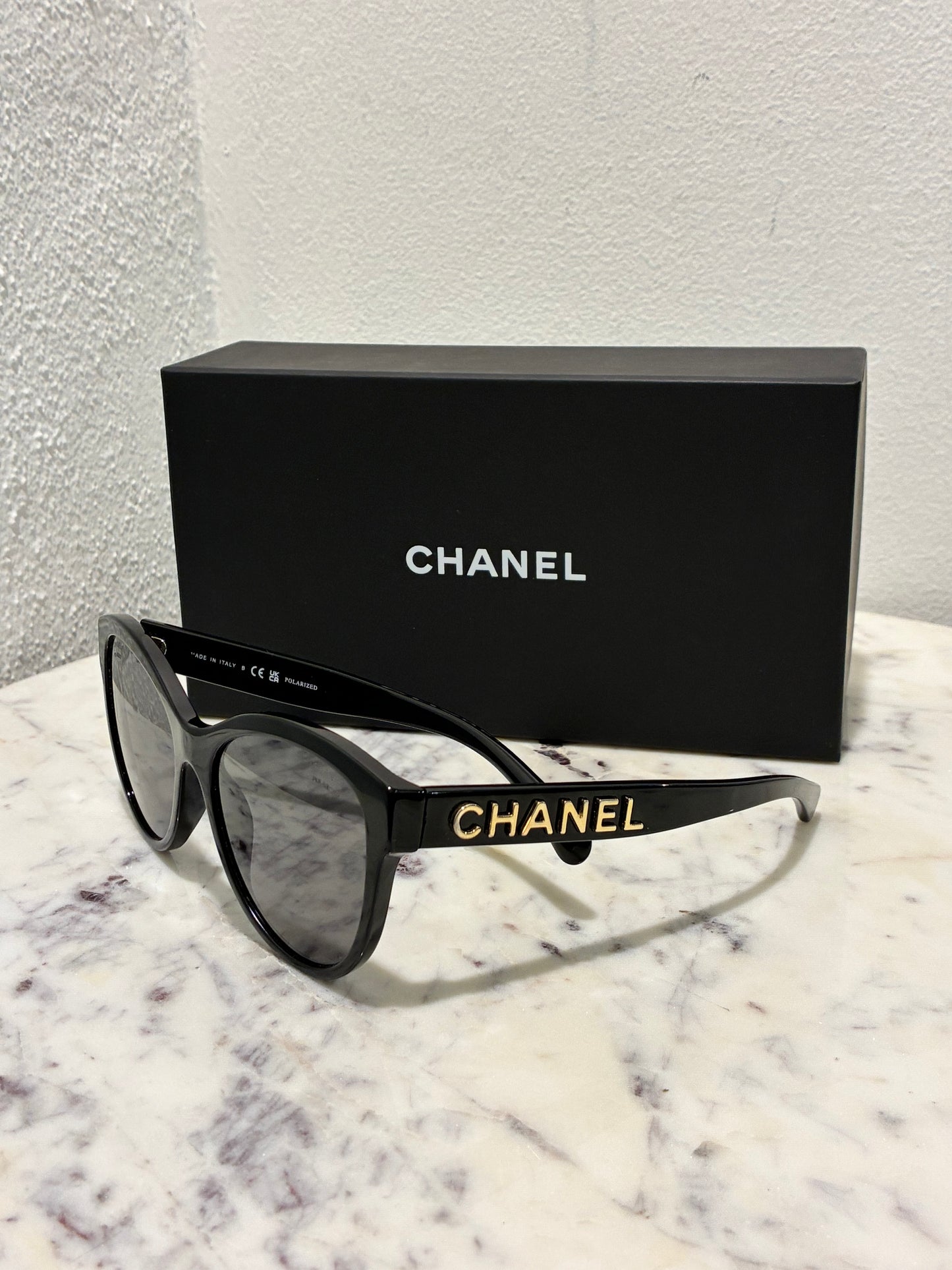Chanel Sunglasses - Gold CHANEL Logo text