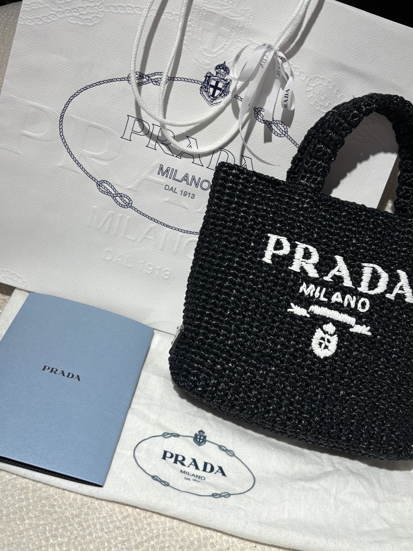 Prada Raffia Tote – Black with White Logo Text