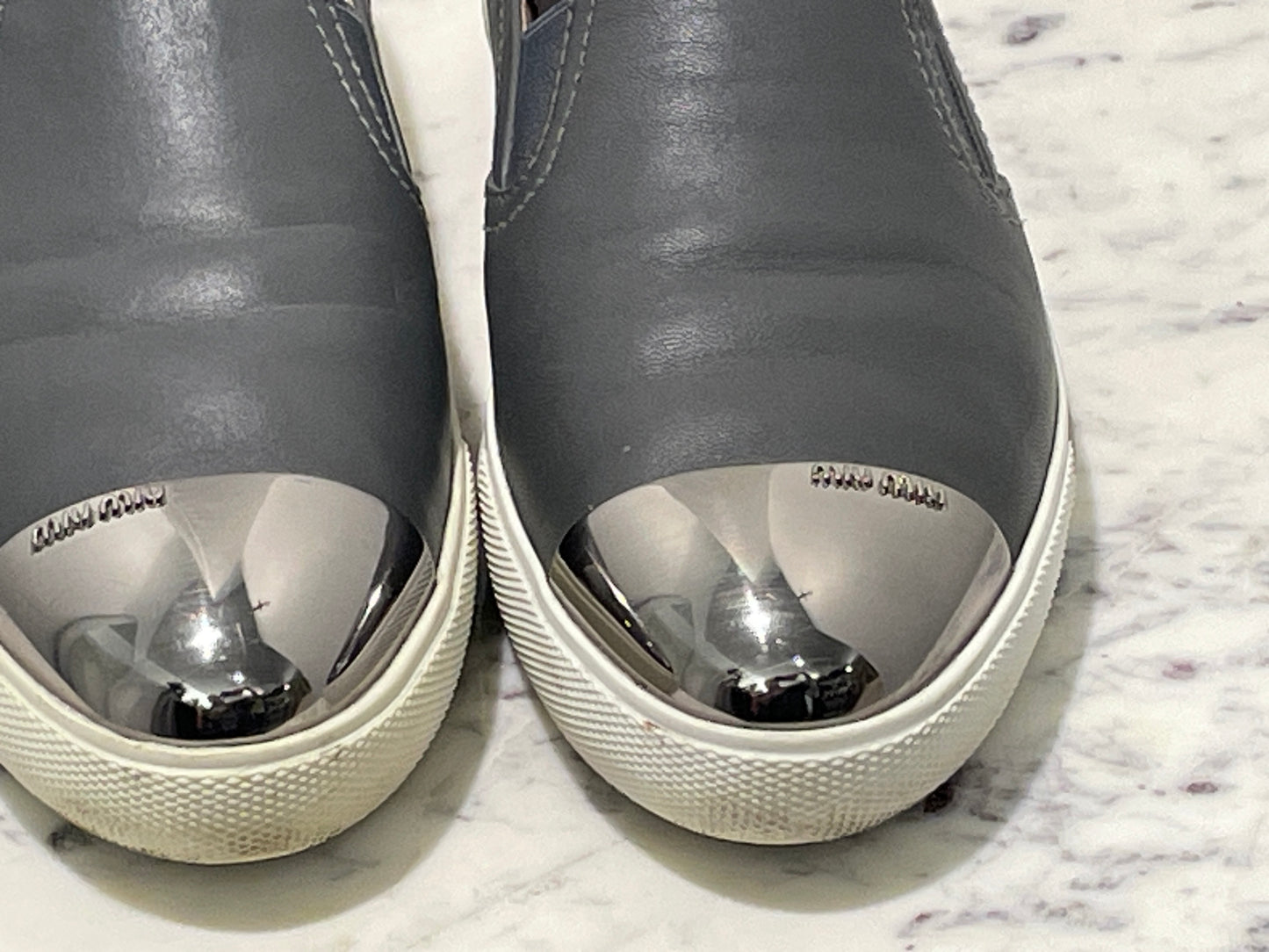 Authentic Miu Miu Grey Leather Metal Cap-Toe Slip-On Sneakers - 39