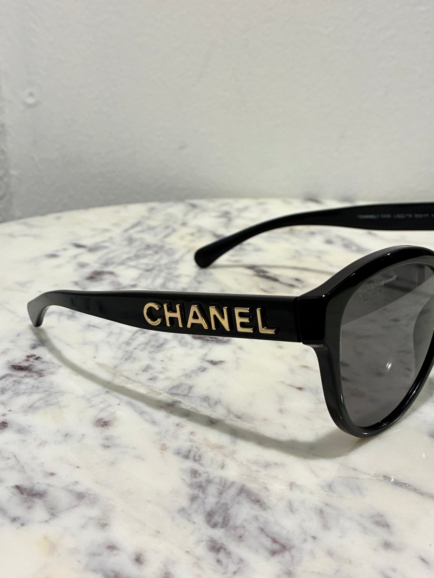 Chanel Sunglasses - Gold CHANEL Logo text